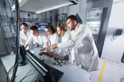 people playing an escape game in a lab