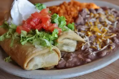 chimichanga with rice and refried beans