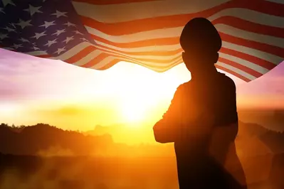 Photo of veteran with sunset over mountains and American flag
