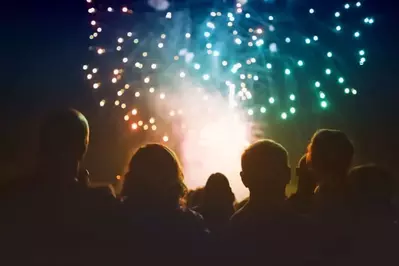 A crowd watching fireworks.