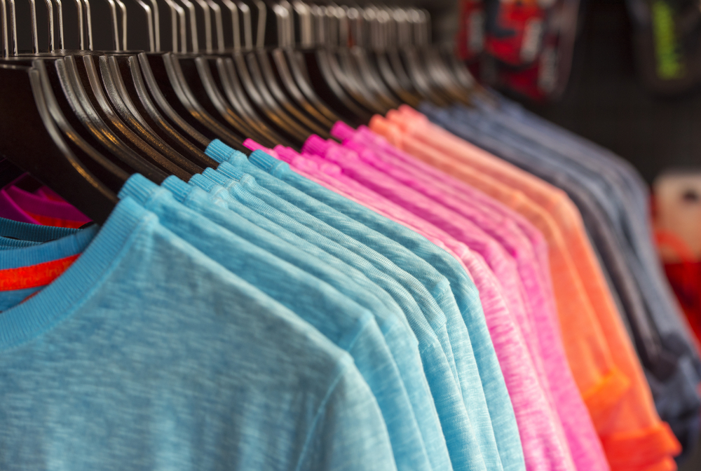 colored t shirts on rack in store