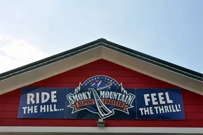 Smoky Mountain Alpine Coaster sign on building