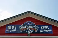 Smoky Mountain Alpine Coaster sign on building