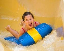 A girl enjoying a water slide at Dollywood's Splash Country in Pigeon Forge TN.