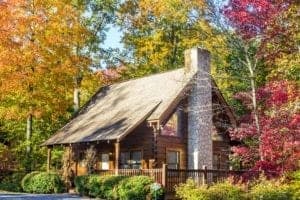 house in the woods in the fall