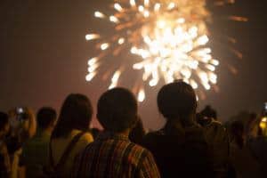 People watching a fireworks display.