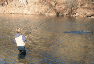 a kid fly fishing