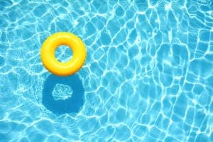 yellow inner tube floating in a pool